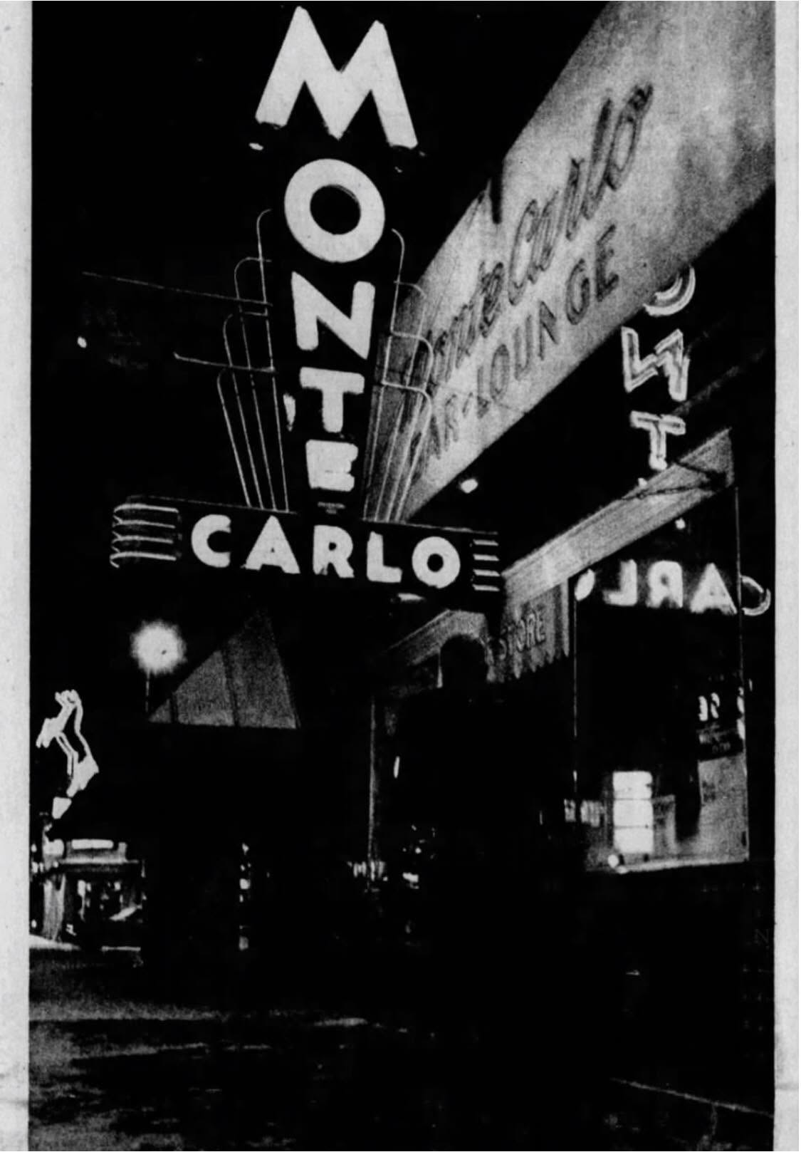 Vintage black-and-white photograph of the Monte Carlo exterior and neon signs