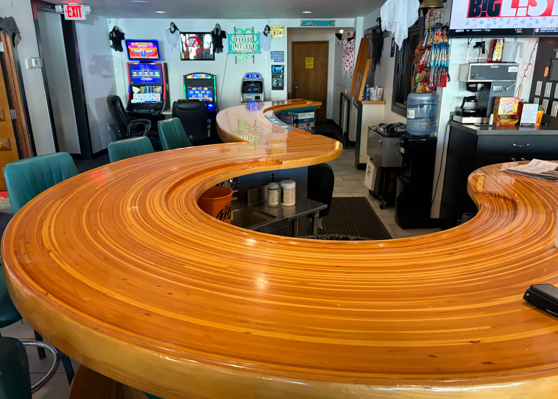 Close-up of The Monte’s family-built curved wooden bar top